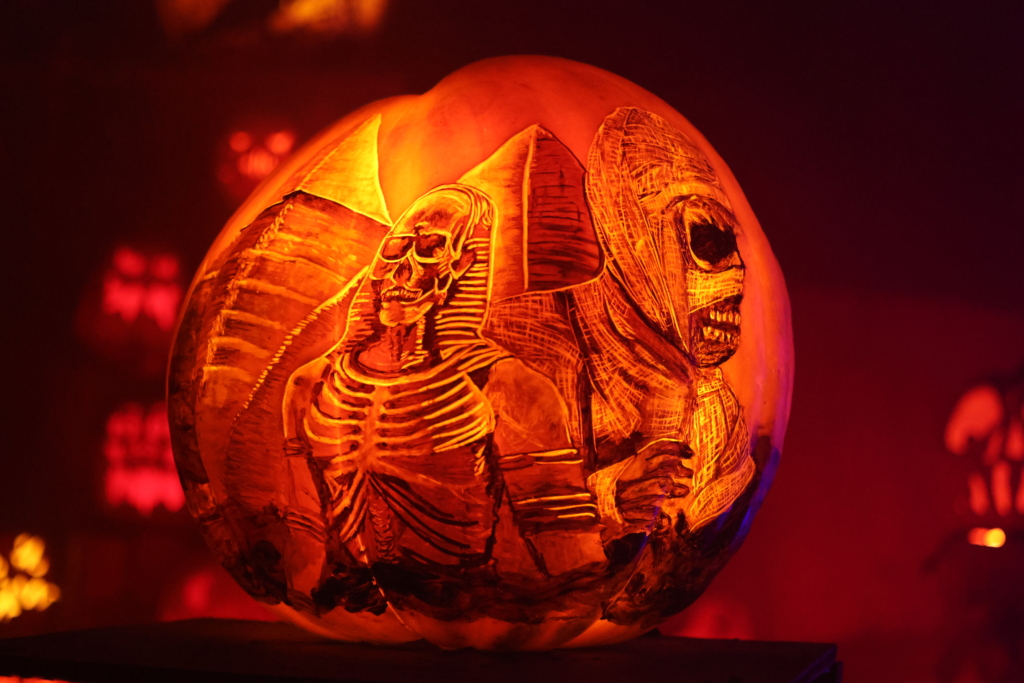 pumpkin intricately carved with mummy and egyptian images on it